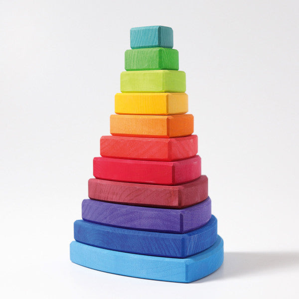 a childs stacking toy made up of varying sizes of triangles in a rainbow spectrum