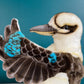 side view of kookaburra puppet showing face detailing and feather details on wing